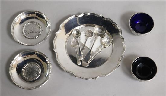 A 1970s silver stand, two white metal dishes inset with coins, a pair of Victorian silver salts and five silver small spoons.